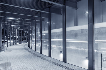 Empty modern pedestrian walkway in midtown at night