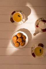 Afternoon tea table. Tea set with sweet cakes or cookies