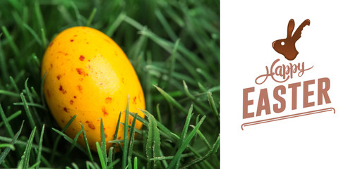 happy easter against yellow speckled easter egg