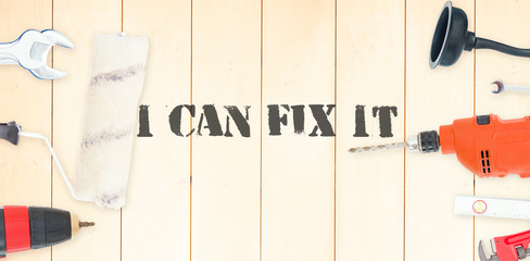 The word i can fix it against diy tools on wooden background