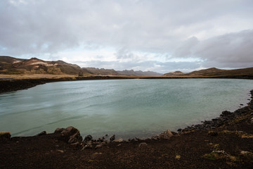 Endless Icelandic Highway between fields. Mountains