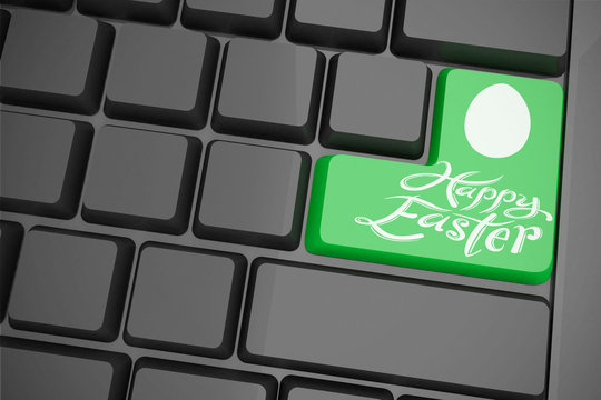 Happy easter against black keyboard with green key