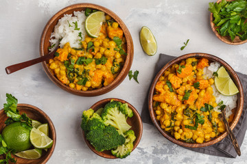 Vegan Sweet Potato Chickpea curry in wooden bowl on a light background, top view, flat lay. Healthy vegetarian food concept.