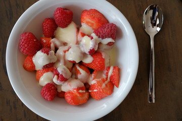 strawberries and raspberries in a bowl 