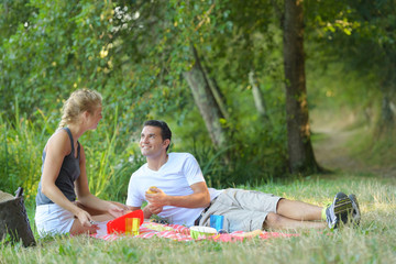 young man and woman at picnic