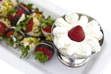 Fresh strawberries in chocolate with whipped cream