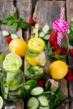 Mohito drinks on wooden with blur beach background. Fresh drinks with fruits on wood. Summer concept.