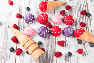 Ice cream, Berry ice cream scoop in waffle cone on wooden table