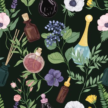 Floral seamless pattern with gorgeous tender blooming flowers and perfume in glass bottles or flasks on black background