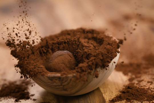 Chocolate Truffle In Cacao Powder In Wood Bowl On Table