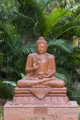 A budha statue in the garden in mysore during a weekend vacation