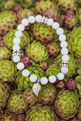 yoga bracelet with natural beads on houseleek background