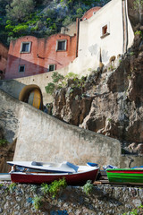 Fototapeta na wymiar Old houses and boats on the beach of Furore, Amalfi coast, Italy