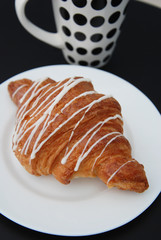 Coffee and Croissants White Chocolate Breakfast morning Isoalted on Black Table.