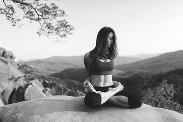 Young woman practicing yoga outdoors