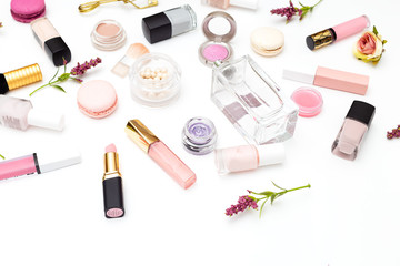 Make up products and flowers on white background. Beauty