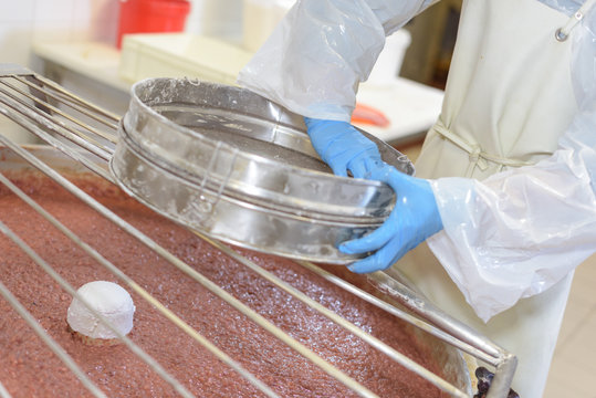 pouring ingredients into a mixer
