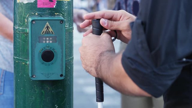 disability, safety, independence- blind man at the traffic lights