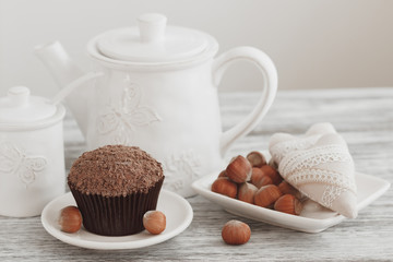 Cups with cacao and marshmallow, cupcakes and different decorations