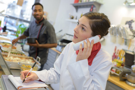 female worker on the phone at butchery