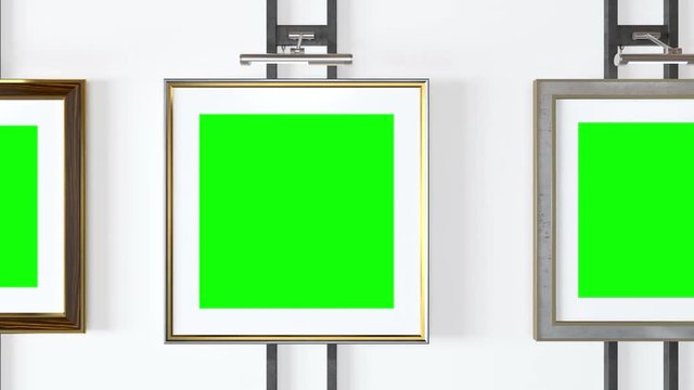 Empty picture frames with track green screen and a spotlight lamps - Seamlessly looping