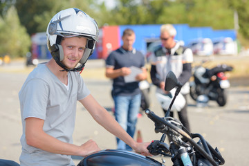 young man during motorcycle lesson