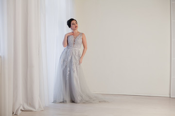 Fototapeta na wymiar brunette woman in gray wedding gown