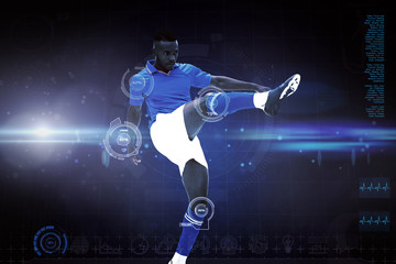Obraz na płótnie Canvas Football player against blue dots on black background
