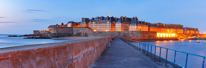 Panoramic night view of walled city Saint-Malo with St Vincent Cathedral, famous port city of...