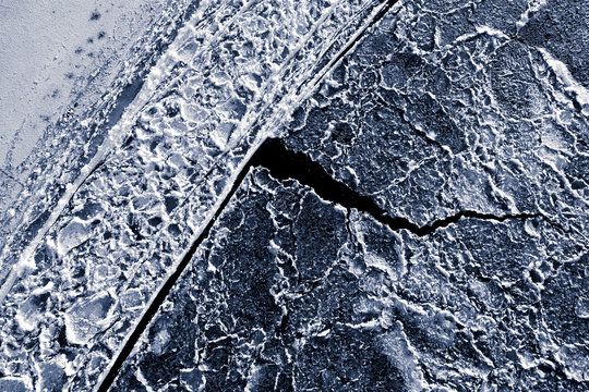 Ice formations on frozen river 
