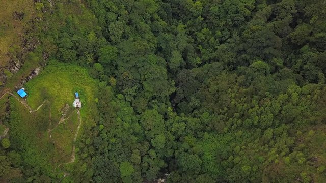 AERIAL 4K: Flying over trees to view of Toba lake, the most popular tourist destination in North Indonesia
