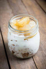 Healthy and tasty breakfast with muesli, yougurt and grilled pears. Selective focus.