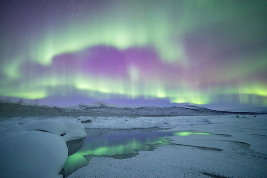 Aurora borealis reflection on the river 
