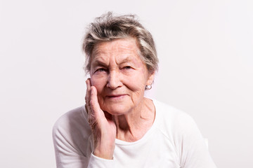 Portrait of a senior woman in studio.