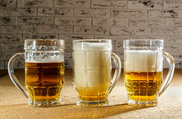 Glasses with beer on the table.