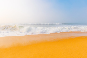 Picturesque scenery seascape of foggy misty abandoned wild beach. Art beautiful landscape of deserted cost with ocean waves. Colorful nature paysage. Desolate mediterranean coastline. Fairy tale view.