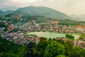 Fototapeta premium Aerial view of landmark landscape at the hill town in Sapa city with the sunny light, Vietnam