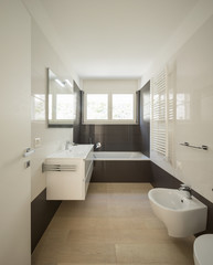 Naklejka na ściany i meble Modern bathroom with large dark tiles