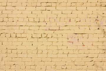 background of brick wall painted in yellow, texture of old brick