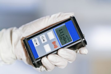 Man checking radiation with geiger counter