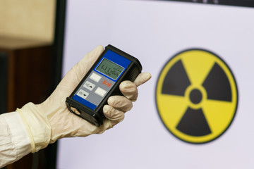 Man checking radiation with geiger counter