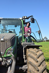 portrait of a farmer woman and tractor © Curto