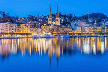 LUZERN,SWITZERLAND - APRIL 15, 2018: River Reuss with church of Saint Leodegar in Luzern. Luzern is a city in central Switzerland.