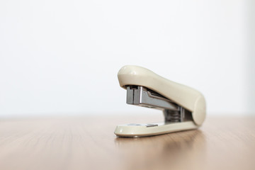 Stapler on wood table