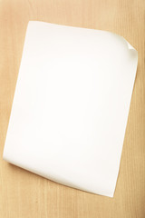 White paper with fold inside corner on wood background, Blank paper