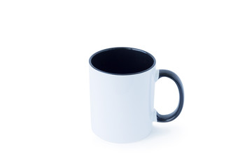 A white mug, with a black handle on a light background. 