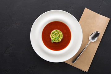 Cold tomato soup gazpacho with avocado copy space