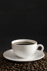 Cup of Strong Black Coffee in a White Cup and Saucer