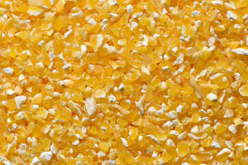 Yellow corn grits close-up. Raw corn grits for breakfast porridge