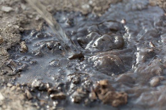 Watering Dark Brown Soil